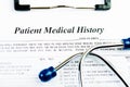 Medical history document with medicine and stethoscope Royalty Free Stock Photo
