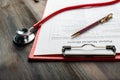 medical history with stethoscope and pen Royalty Free Stock Photo