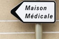 Medical homecare road sign called maison medicale in French language Royalty Free Stock Photo