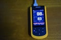 Medical instrument, digital handheld blood oxygen detector use to monitoring blood oxygen of patient in hospital.