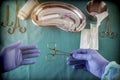 Medical and instrumentalist nurse working in an operating room with scissors of surgery