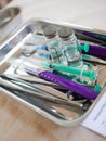 Medical instruments in a metal bowl. syringe, tweezers, scalpel. Clean instruments before surgery Royalty Free Stock Photo