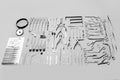 Medical instruments used for surgical operations, laid out on a gray background Royalty Free Stock Photo