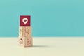 Medical insurance. Health, life assurance. Healthcare and medicine concept. Stack of wooden cube with cross sign on top