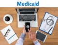 Medical insurance and Medicaid and stethoscope. Royalty Free Stock Photo