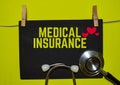 MEDICAL INSURANCE on top of yellow background Royalty Free Stock Photo