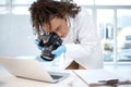 Medical investigation, camera and black woman with laptop in laboratory for forensic research with evidence. Photography