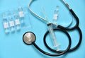 Medical items collection syringe and glass ampoules, stethoscope Royalty Free Stock Photo