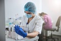 Medical laboratory scientist examining a clinical specimen