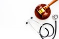 Medical law, health law concept. Gavel and stethoscope on white backgound top view copy space Royalty Free Stock Photo
