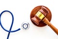 Medical law, health law. Gavel and stethoscope on white backgound top view copy space Royalty Free Stock Photo