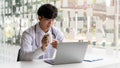 Medical, a male doctor attending online meeting pointing at the pill bottle to explain the pillÃ¢â¬â¢s properties