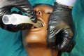 Medical manipulation for airway management. Laryngeal mask airway insertion by stuff in a black gloves on a simulation mannequin