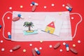 Medical mask and children`s drawings of a palm tree and a house on it. Lots of pills. Concept of a coronavirus pandemic. Stay at Royalty Free Stock Photo