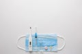 Medical mask on cyan, blue background.face mask. mask for diseases. Thermometer and medication. disposable face image. Medical