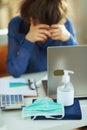 Medical mask and hand disinfectant and stressed woman Royalty Free Stock Photo