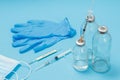 Medical mask, syringes, gloves and bottles for liquid medicine Royalty Free Stock Photo