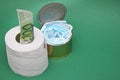 Medical masks in a can next to a roll of toilet paper and a 100 Euro bill in it Royalty Free Stock Photo