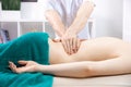Medical massage of back young woman, closeup of hands of male doctor osteopath