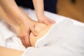 Medical massage at the leg in a physiotherapy center. Royalty Free Stock Photo