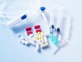 Medical and medicine kits with pills, saline tubes and needles. Royalty Free Stock Photo