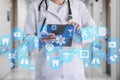 Medical network connection on the virtual touch screen and Doctor with stethoscope in hospital background.