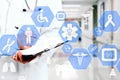 Medical network connection on the virtual touch screen and Doctor with stethoscope in hospital background.Technology and medicine