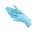 Medical nitrile gloves.Two blue surgical gloves isolated on white background with hands. Rubber glove manufacturing, human hand Royalty Free Stock Photo