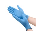 Medical nitrile gloves.Two blue surgical gloves isolated on white background with hands. Rubber glove manufacturing, human hand Royalty Free Stock Photo