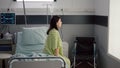 Medical nurse black woman checking hospitalized sick patient