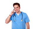 Medical nurse man talking on his cellphone Royalty Free Stock Photo