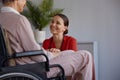 Medical nurse or social worker and elderly patient at nursing home Royalty Free Stock Photo