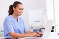 Medical nurse in uniform using laptop Royalty Free Stock Photo