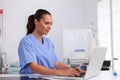 Medical nurse in uniform using laptop Royalty Free Stock Photo