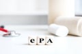 Medical office background with dice, word ePA, which means german elektronische Patientenakte