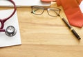 Medical and office objects on the table. Stethoscope macro view Royalty Free Stock Photo