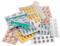 Medical pack of pills and syringe on white Royalty Free Stock Photo