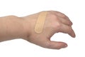 Medical patch plaster on woman hand isolated on the white background Royalty Free Stock Photo