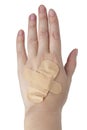 Medical patch plaster on woman hand isolated on the white background Royalty Free Stock Photo