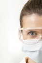 Close-up portrait of dentist wearing surgical mask and eyewear at clinic Royalty Free Stock Photo