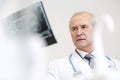 Closeup of doctor examining dental x-ray at dental clinic