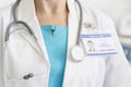 Midsection of doctor with stethoscope and identity card at hospital Royalty Free Stock Photo