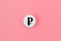 Medical pill with ruble currency sign on a pink background. Rise in the price of medicines. Expensive medicine in Russia