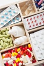 Medical pills and ampules in wooden box Royalty Free Stock Photo