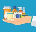 Medical pills and bottles in hand of doctor Royalty Free Stock Photo