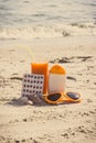 Medical pills, carrot juice and accessories for sunbathing at beach, vitamin A and beautiful, lasting tan Royalty Free Stock Photo