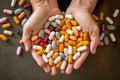 Medical pills in hands. Old person hands holding many multicolored pills. Senior health care concept Royalty Free Stock Photo