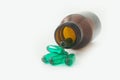 Medical pills out of a toppled from pill bottle Royalty Free Stock Photo