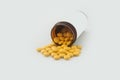 Medical pills spilling out of a toppled from pill bottle Royalty Free Stock Photo