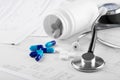 Medical pills and stethoscope. Royalty Free Stock Photo